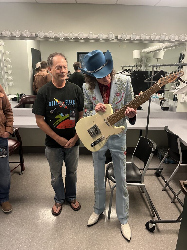 Cameron and Kenny Vaughan sussing out the possibilities on the Schmitzbender guitar.